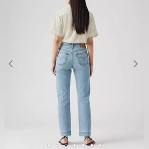 Levi’s 501 straight leg light wash distressed jeans, size 26